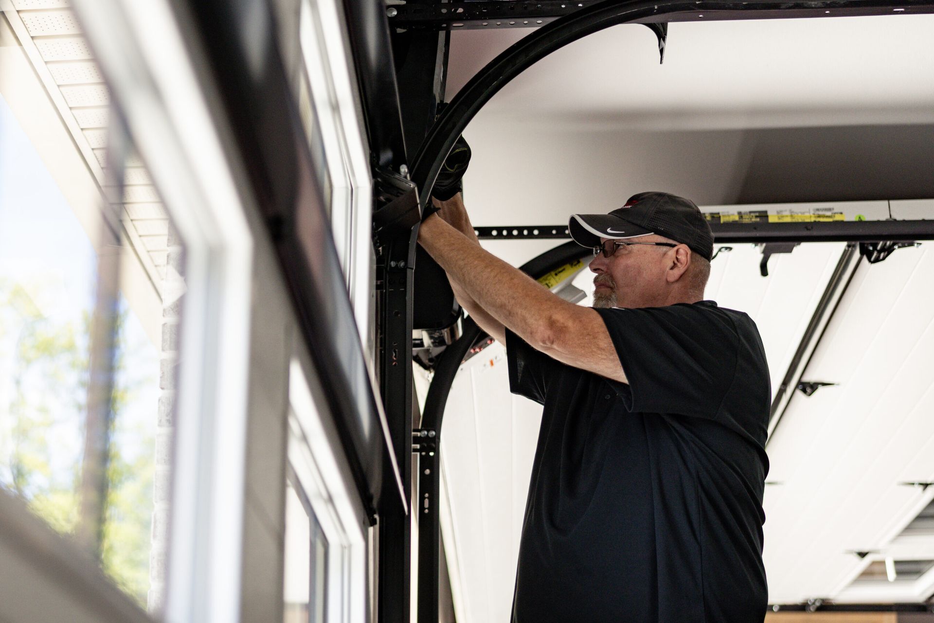 garage door technician testing garage door balance