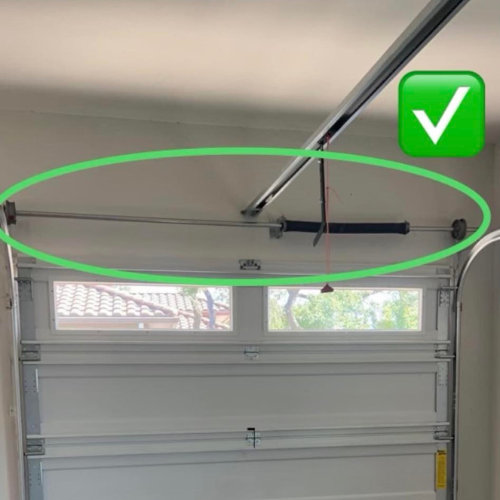 A green check mark is above a garage door
