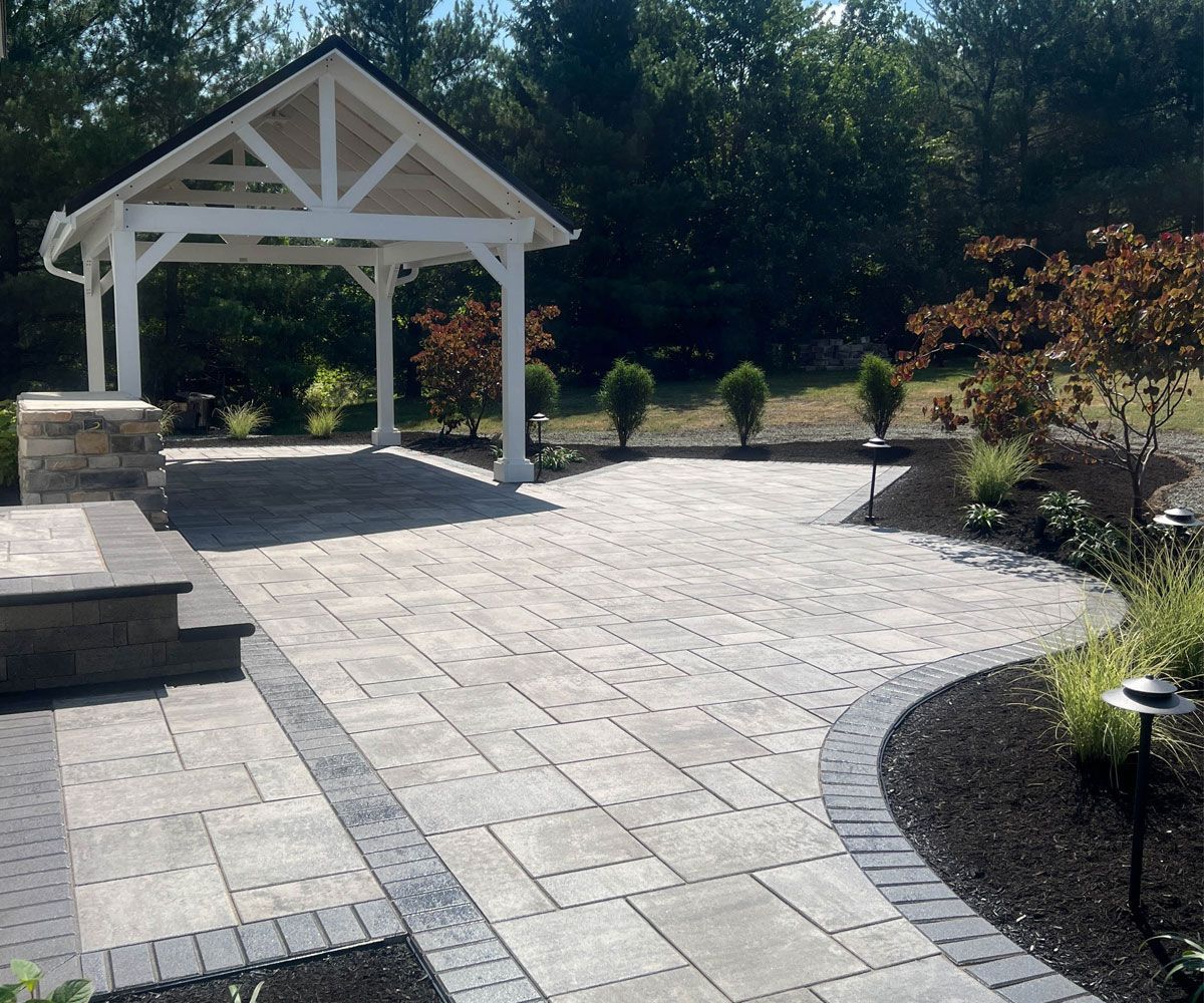 Large slab paver stone walkway to Medina, OH backyard with pavilion and outdoor kitchen