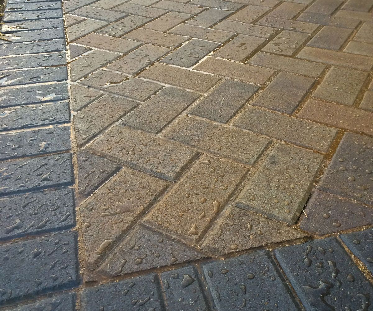 Northeast Ohio backyard patio with herringbone pattern paving stones