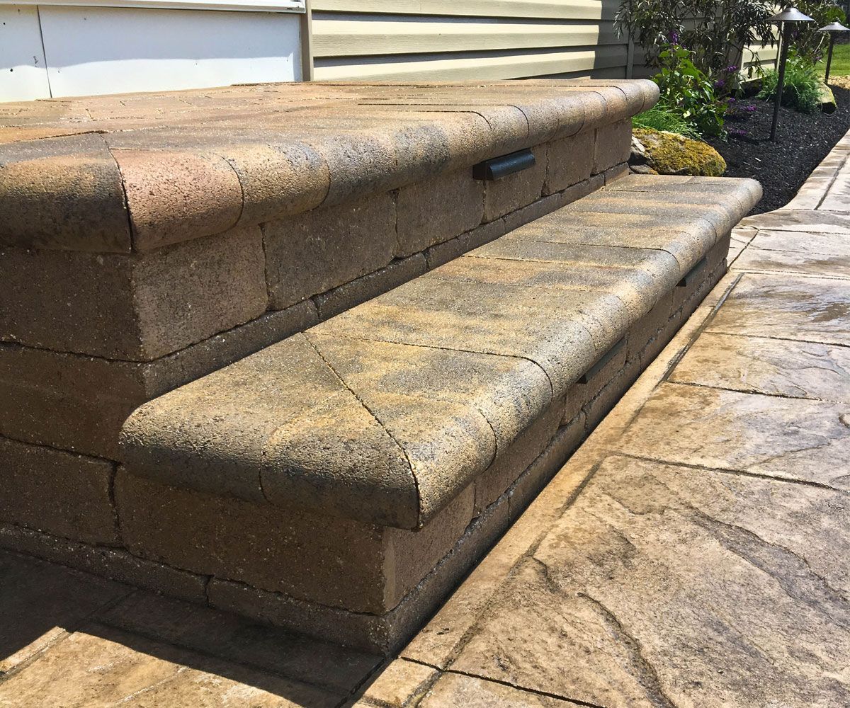 Unilock paver steps with landscape step lighting on Northeast Ohio backyard patio installed by Chidsey Landscape & Design