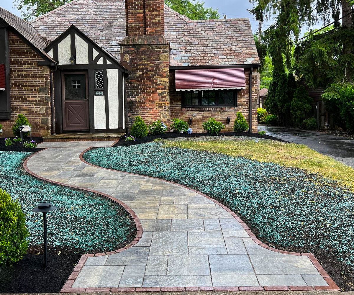 Paver stone front entrance path walkway to Fairlawn, OH home designed and installed by Chidsey Landscape & Design