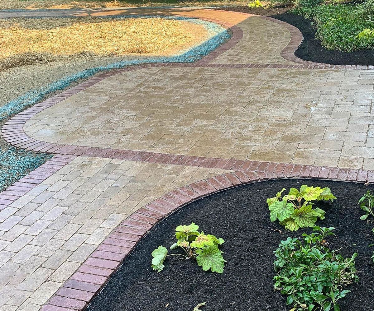 Rounded corner front entrance made from paver stones in Medina, Ohio home designed and installed by Chidsey Landscape & Design