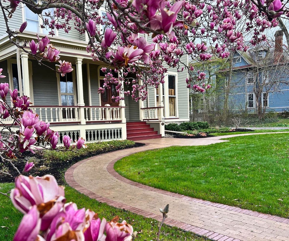 Paver stone front entrance path walkway to Medina Victorian home designed and installed by Chidsey Landscape & Design