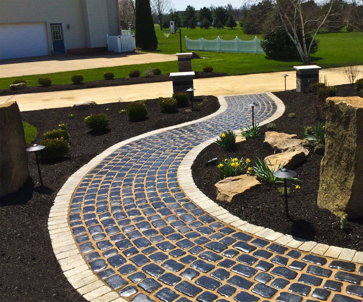 Cobblestone front walkway of Cuyahoga County house designed and installed by Chidsey Landscape & Design