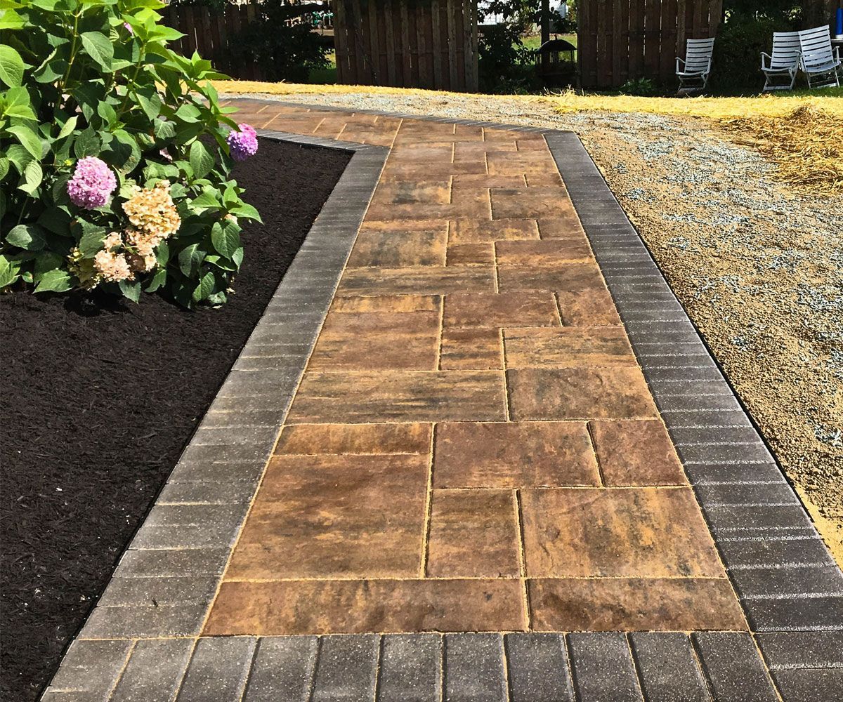 Irregular sizes paver stone walkway of Summit county home side yard installed by landscape contractor Chidsey Landscape & Design