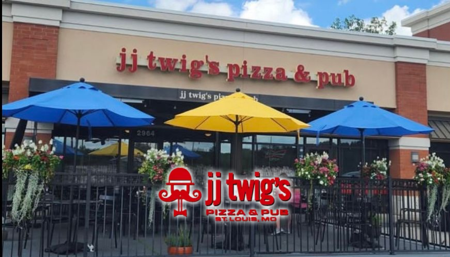 Outdoor patio of JJ Twigs Pizza & Pub with blue and yellow umbrellas