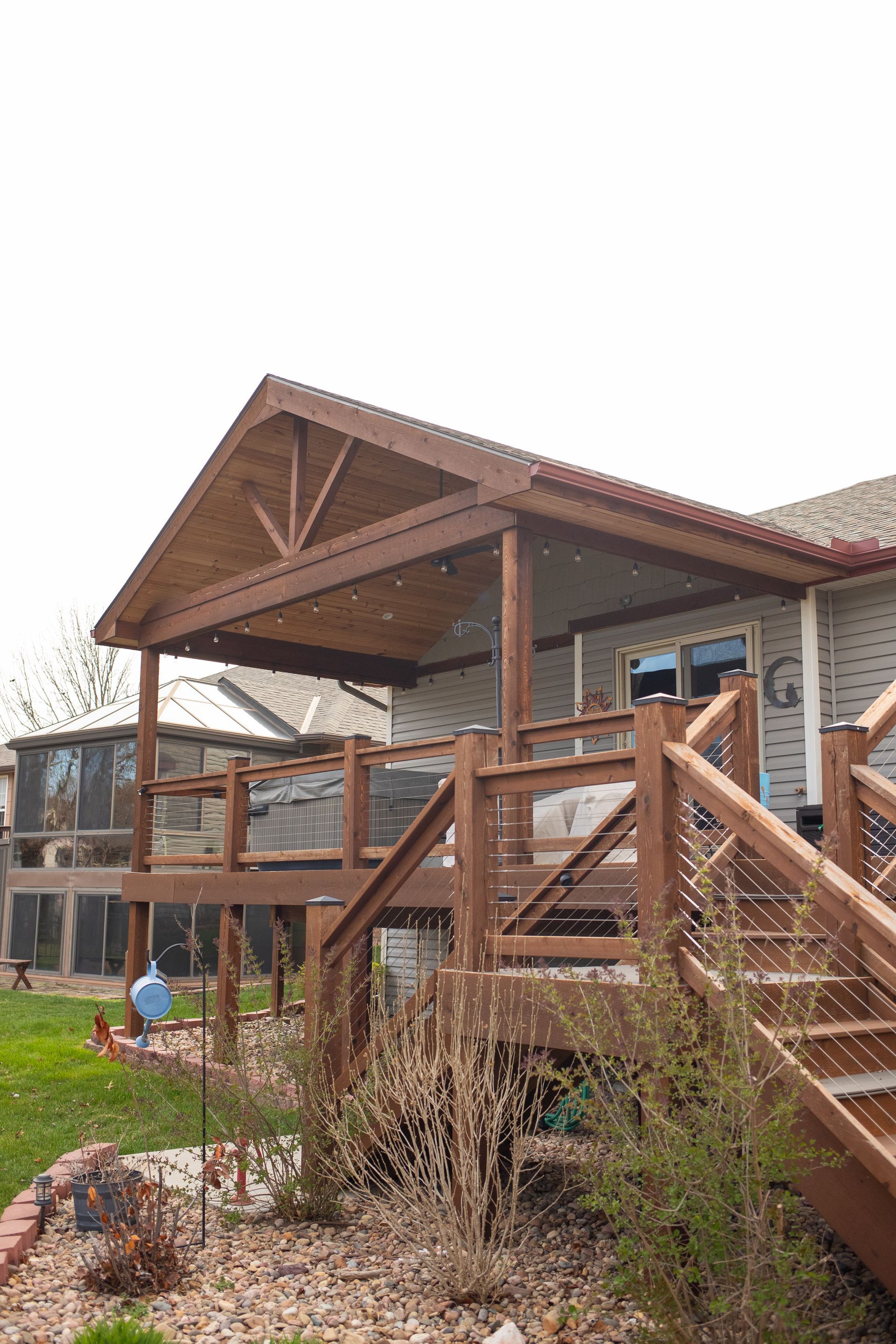 Image taken of a beautiful deck  from the  backyard. 