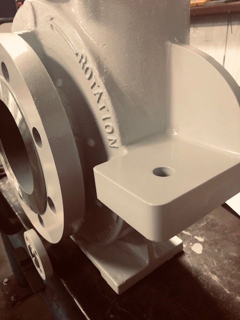 A white machine with the word rotation on it