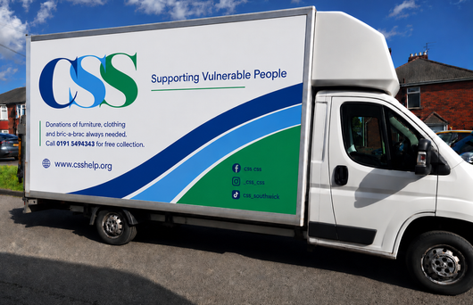 White delivery truck with CSS logo and “Supporting Vulnerable People” on the side, parked outdoors.