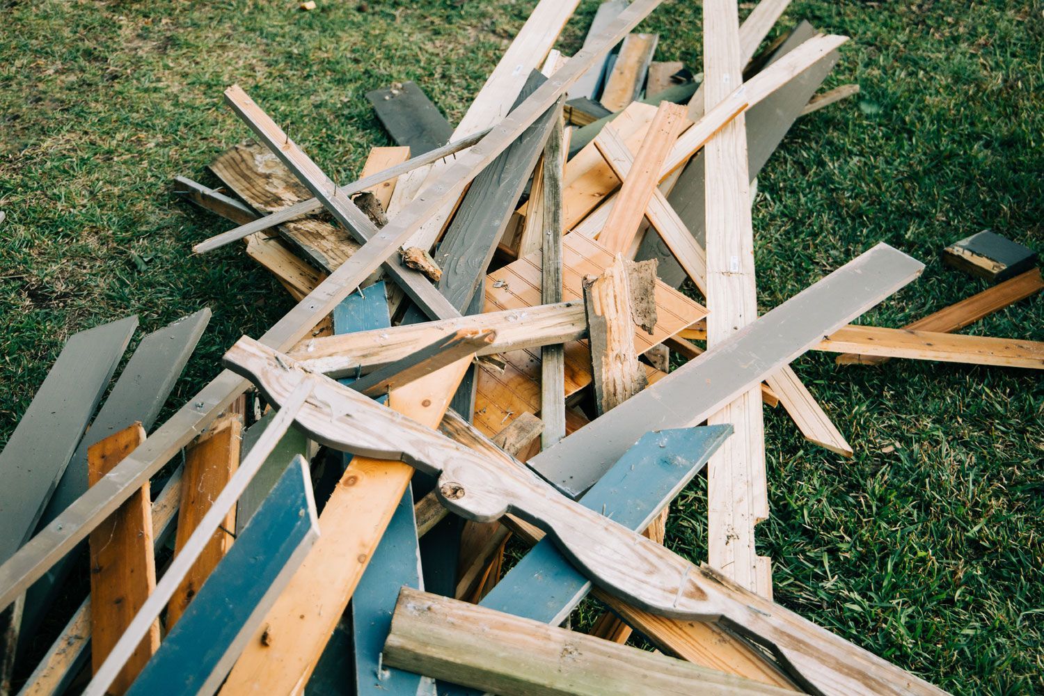a large pile of scrap wood from a demolished building