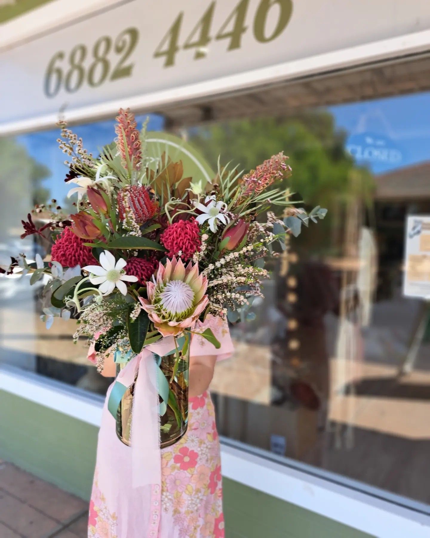 Large Pink Floral Arrangement in A Vase Outside a Storefront Window — Denise's Flower Studio In Nyngan, NSW