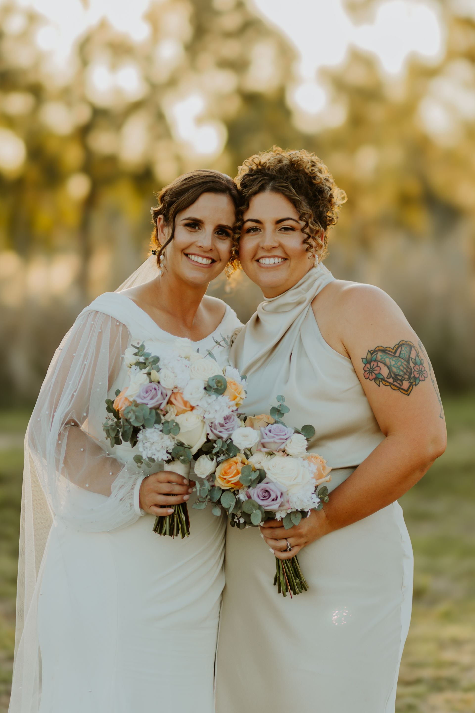 Two Smiling Brides with Bouquets — Denise's Flower Studio In Dubbo, NSW