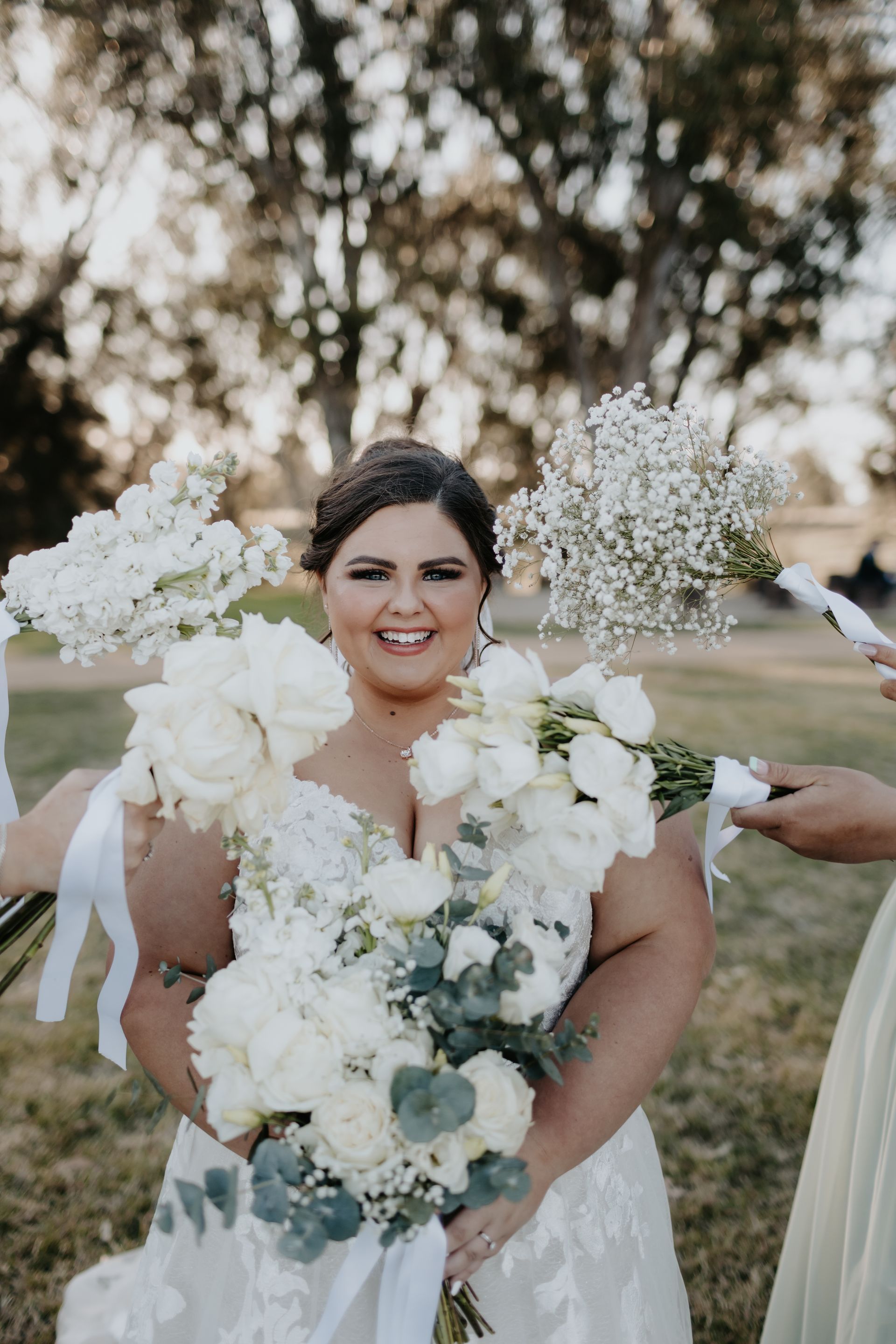 Bride in White Dress Smiles, Holding Bouquet — Denise's Flower Studio In Dubbo, NSW