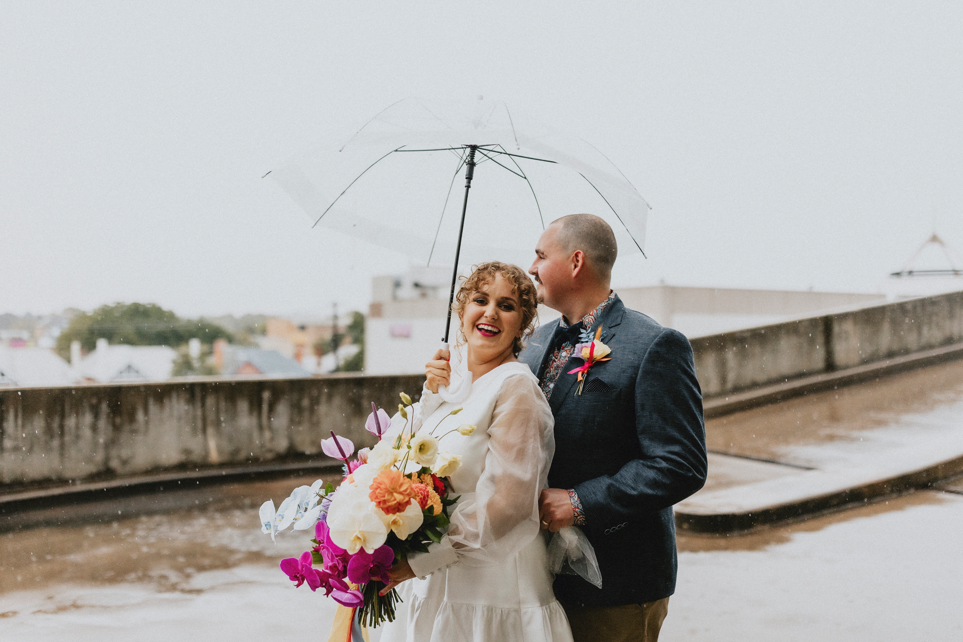 Bride and Groom with Flowers and Umbrella  — Denise's Flower Studio In Dubbo, NSW