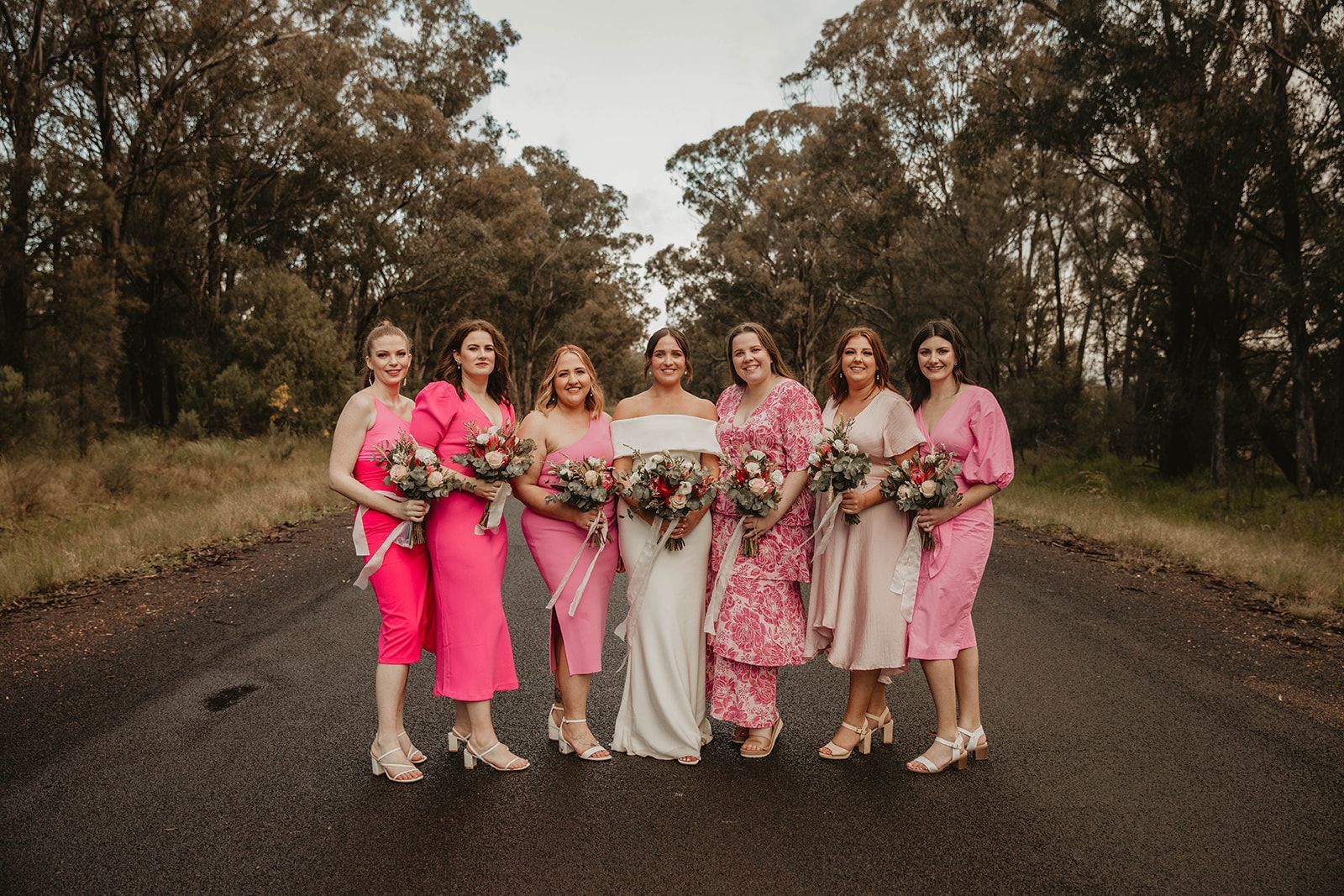 Bridesmaids in Pink Dresses with Bride in White — Denise's Flower Studio In Dubbo, NSW