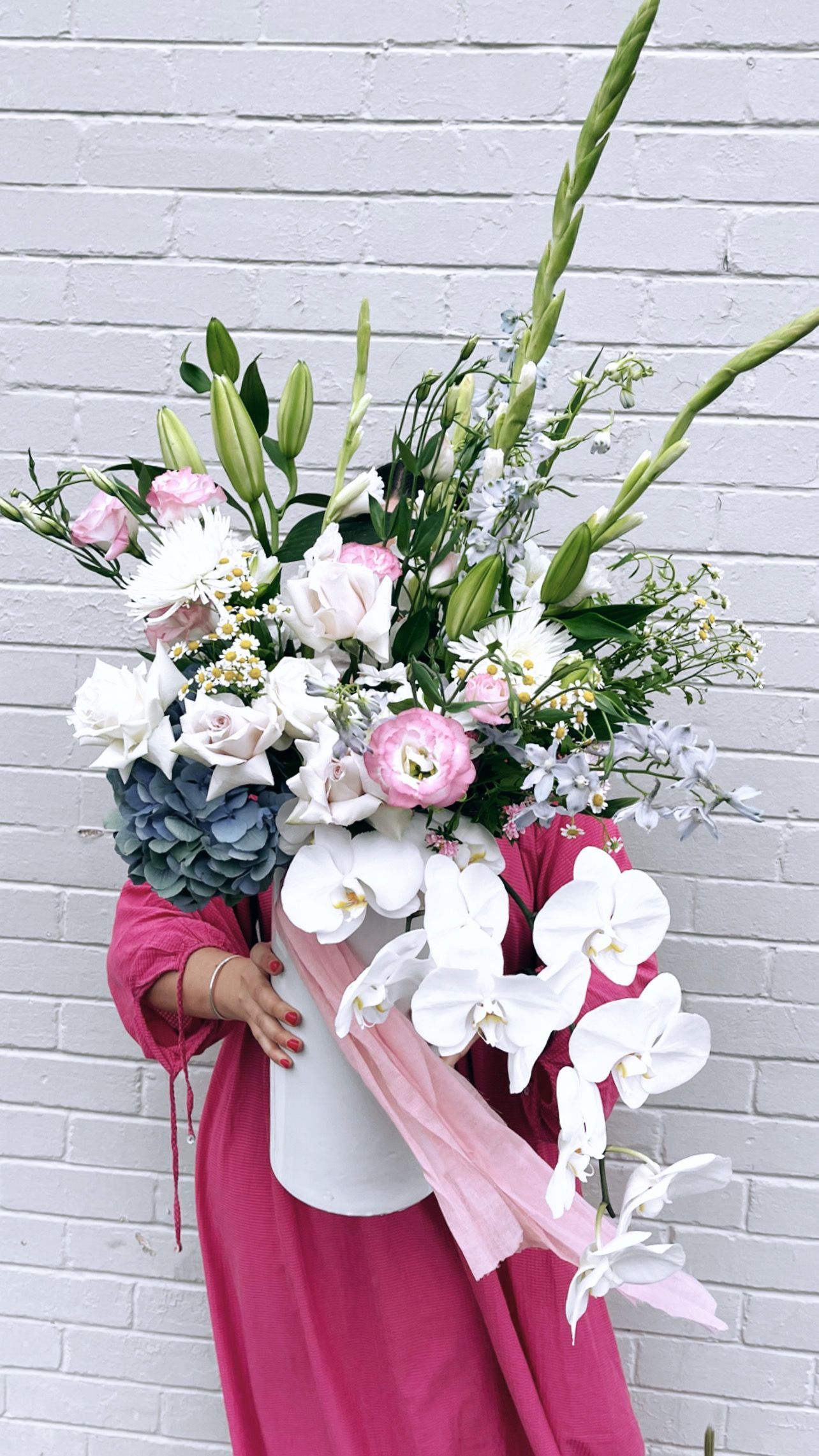 Woman Holding Large Bouquet of Flowers — Denise's Flower Studio In Dubbo, NSW