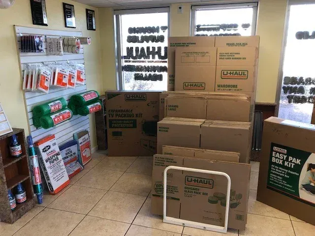 U-Haul store interior with boxes, packing supplies, and display shelves.
