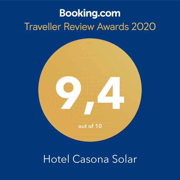 Booking.com Traveller Review Awards 2020 badge for Hotel Casona Solar, score 9.4/10 on blue background