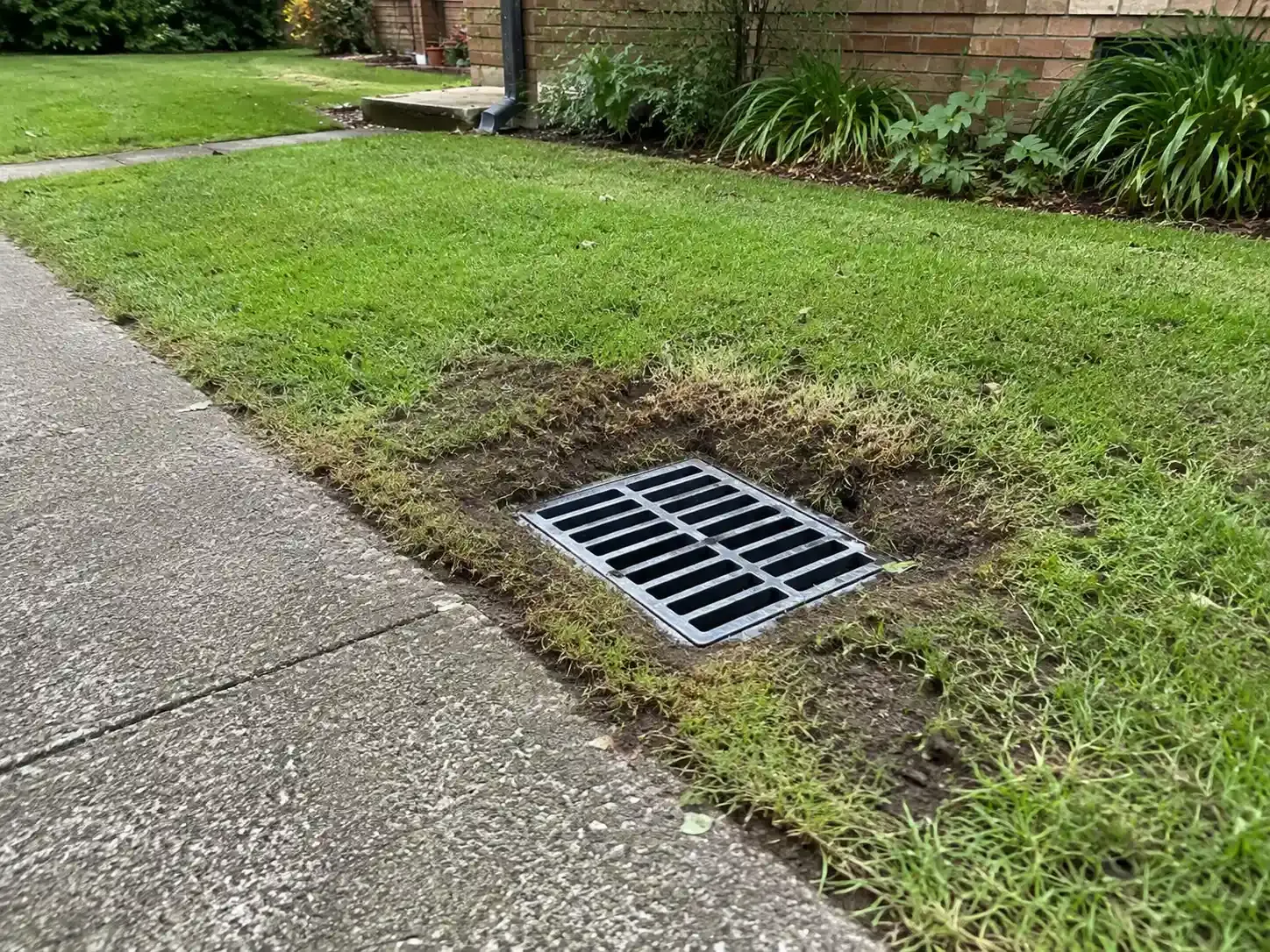 Stormwater pit installed to catch excessive runoff from this path at a home in Bundaberg.
