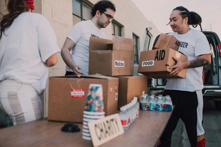 Volunteers loading boxes labeled 