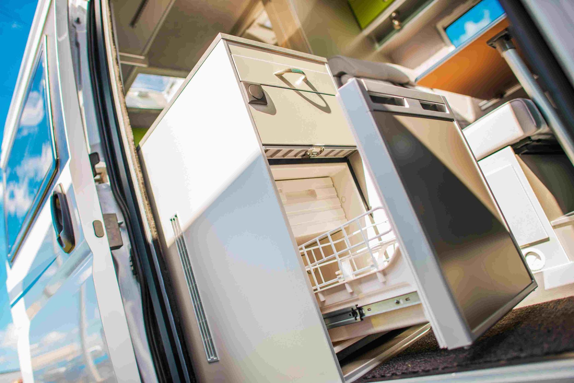 A Refrigerator is Sitting in the Back of a Van — Chilltech Air Conditioning & Refrigeration In Capricorn Coast, QLD
