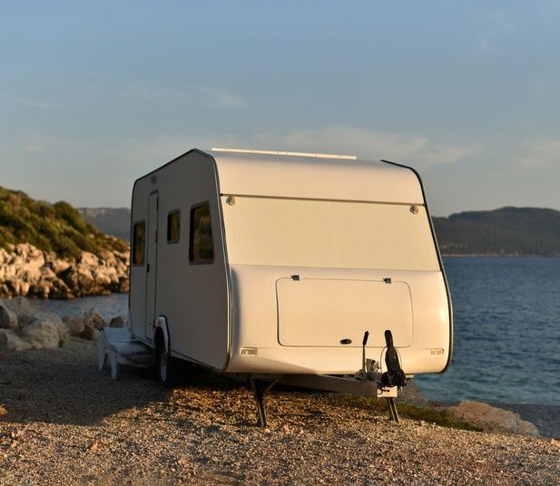 A Caravan is Parked near the Ocean — Chilltech Air Conditioning & Refrigeration In Central Highlands, QLD