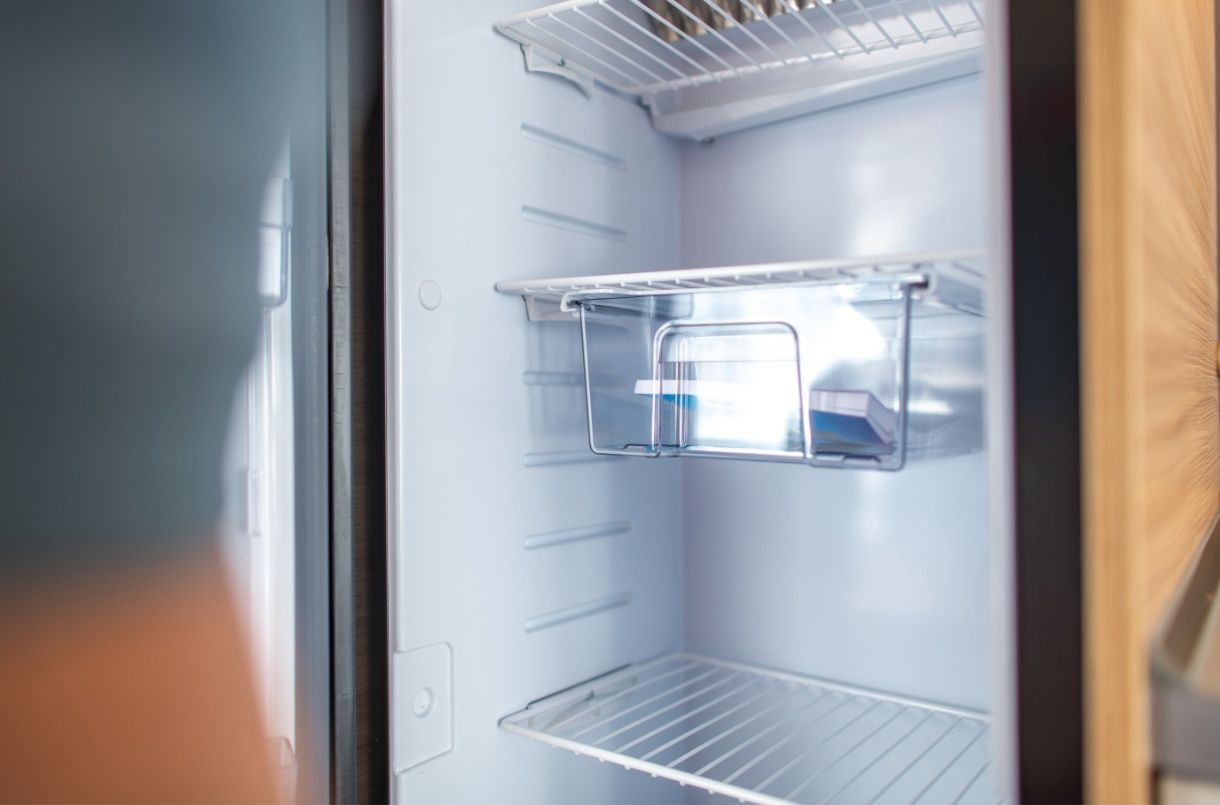 The Inside of an Empty Refrigerator With a Glass Door — Chilltech Air Conditioning & Refrigeration In Rockyview, QLD