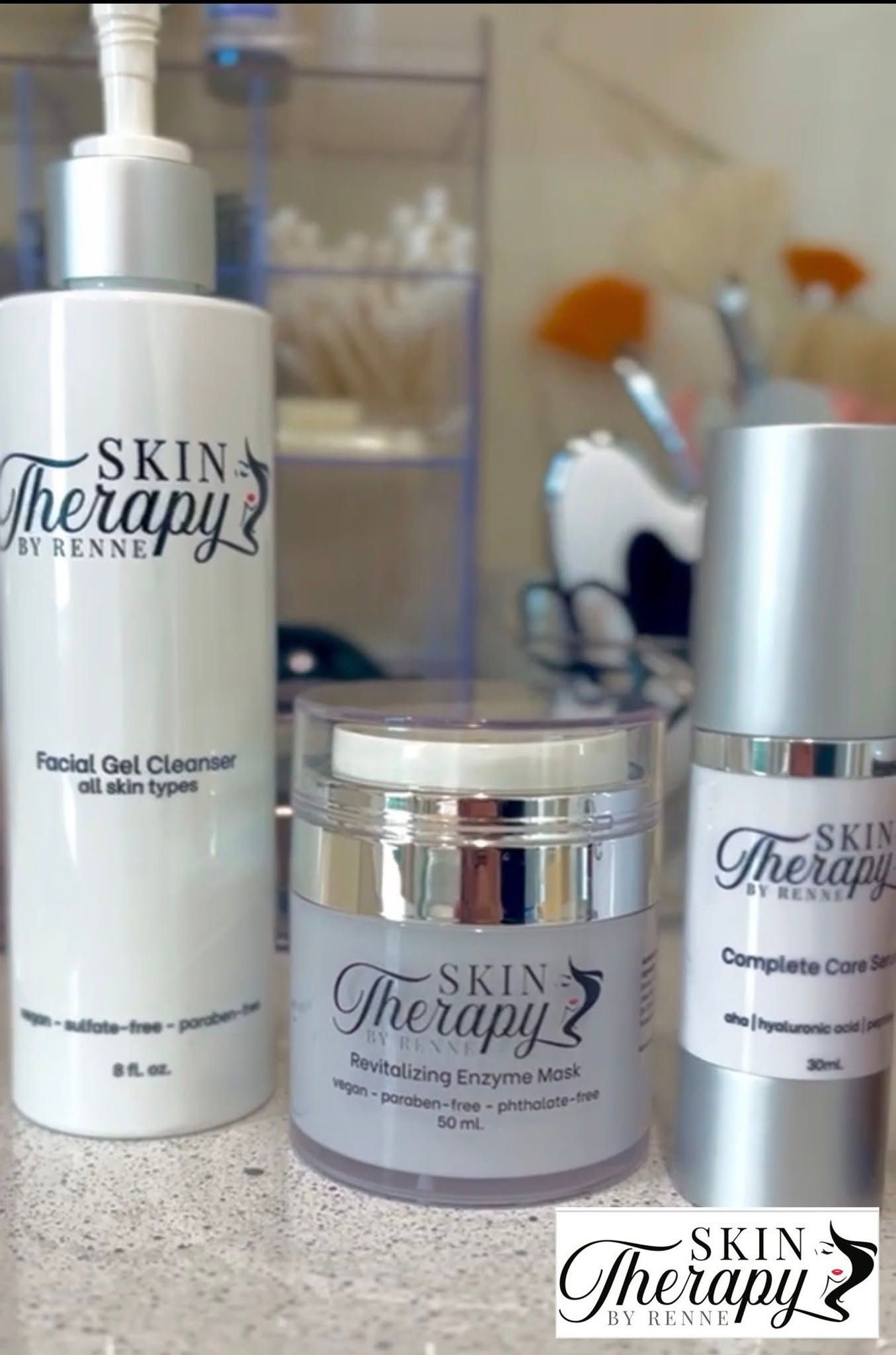 Skin Therapia facial gel cleanser bottle and matching cream jar on a bathroom counter.