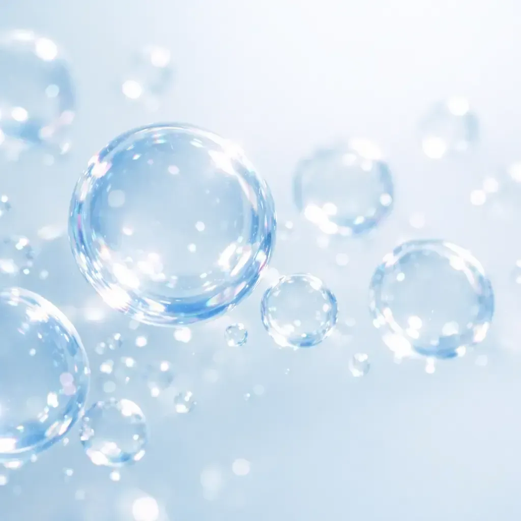 Translucent soap bubbles floating on a soft blue background