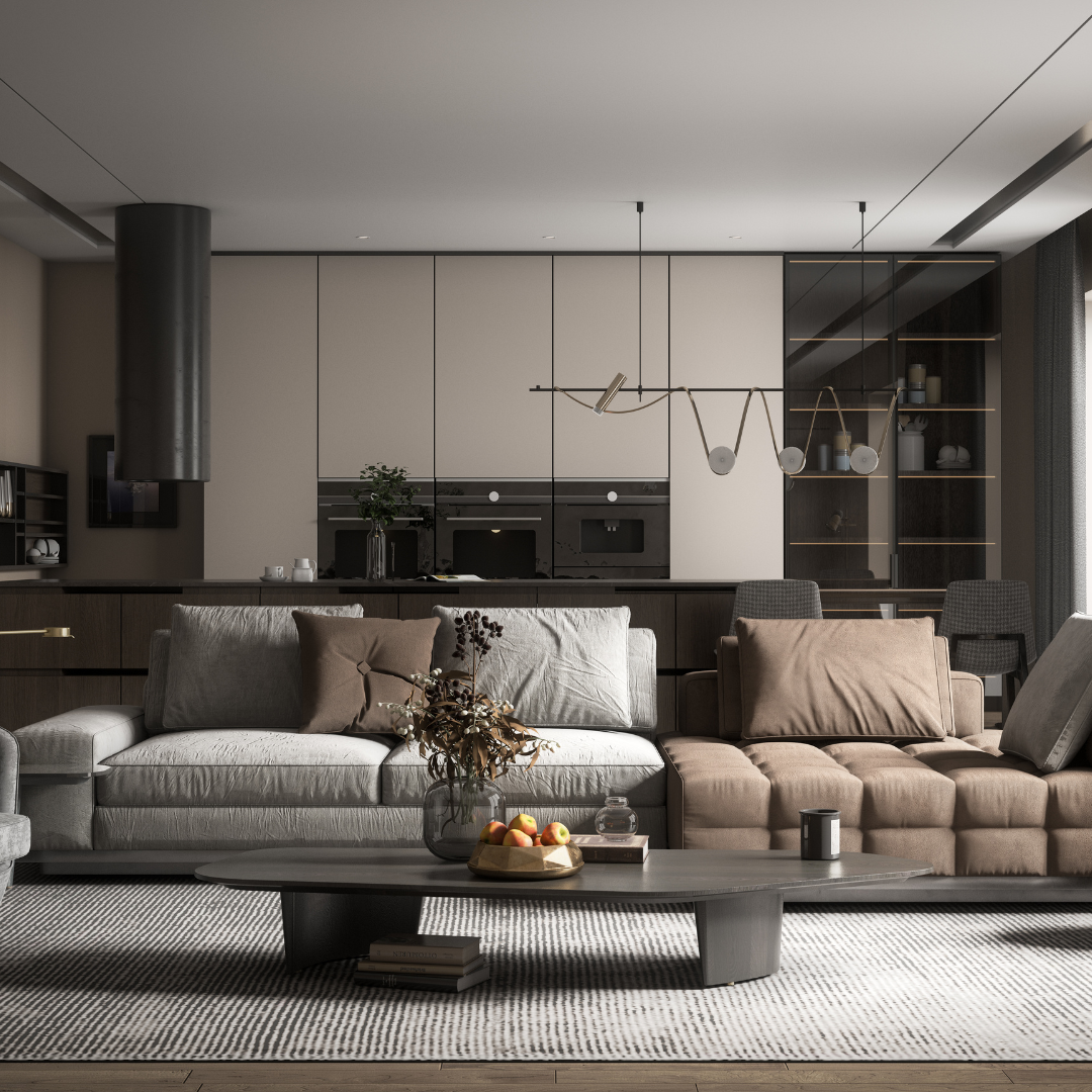 Modern living room with gray and beige sofas, coffee table, pendant lights, and sleek kitchen backdrop