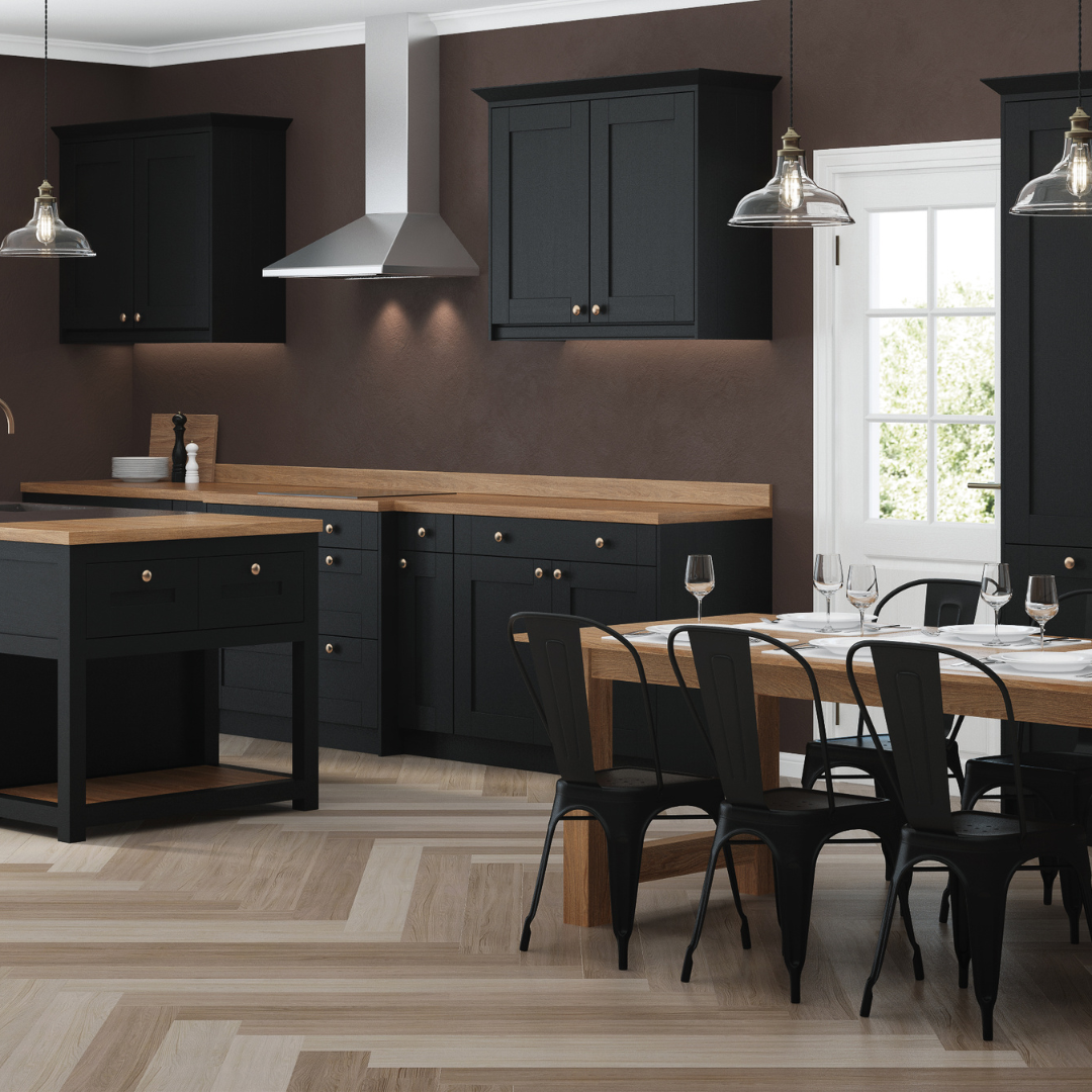 Modern kitchen with dark cabinets, wood countertops, and a black dining table by a bright window