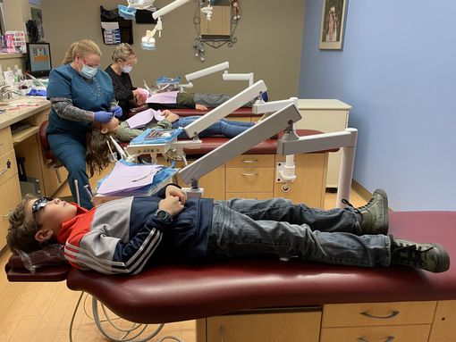 Two kids smiling in La Crosse Two kids smiling after seeing a pediatric dentist serving Onalaska, WI