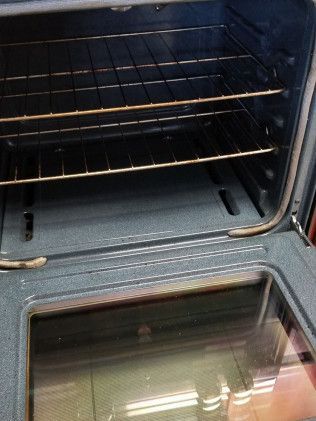 A close up of the inside of an oven with the door open.