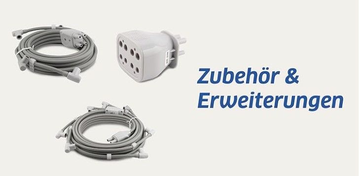 Ein Bündel Drähte liegt nebeneinander auf einem weißen Hintergrund.