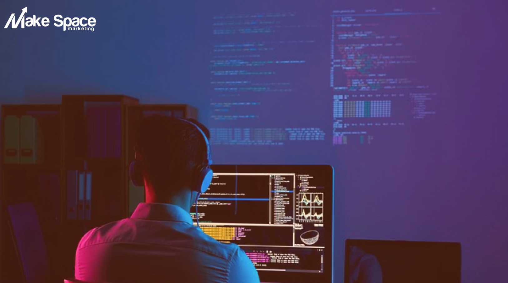 Web developer working in dark room