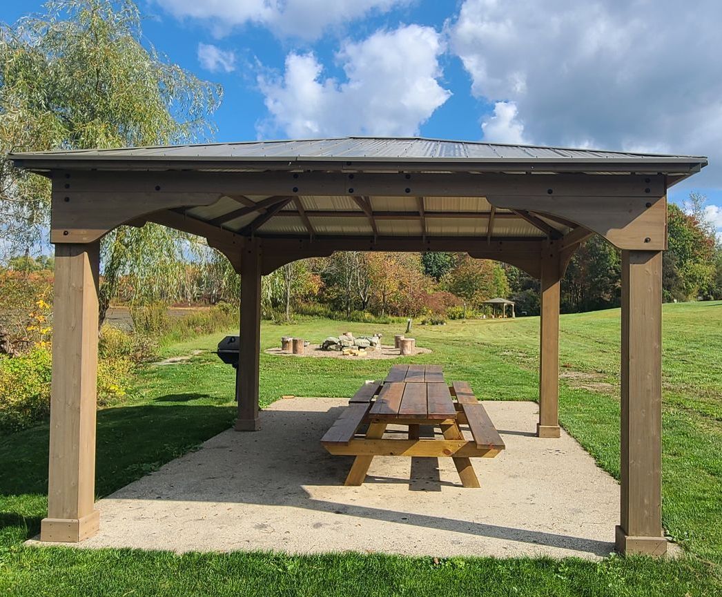 pavilion, picnic table and fire pit by lake lenore at the lodge at chalk hill