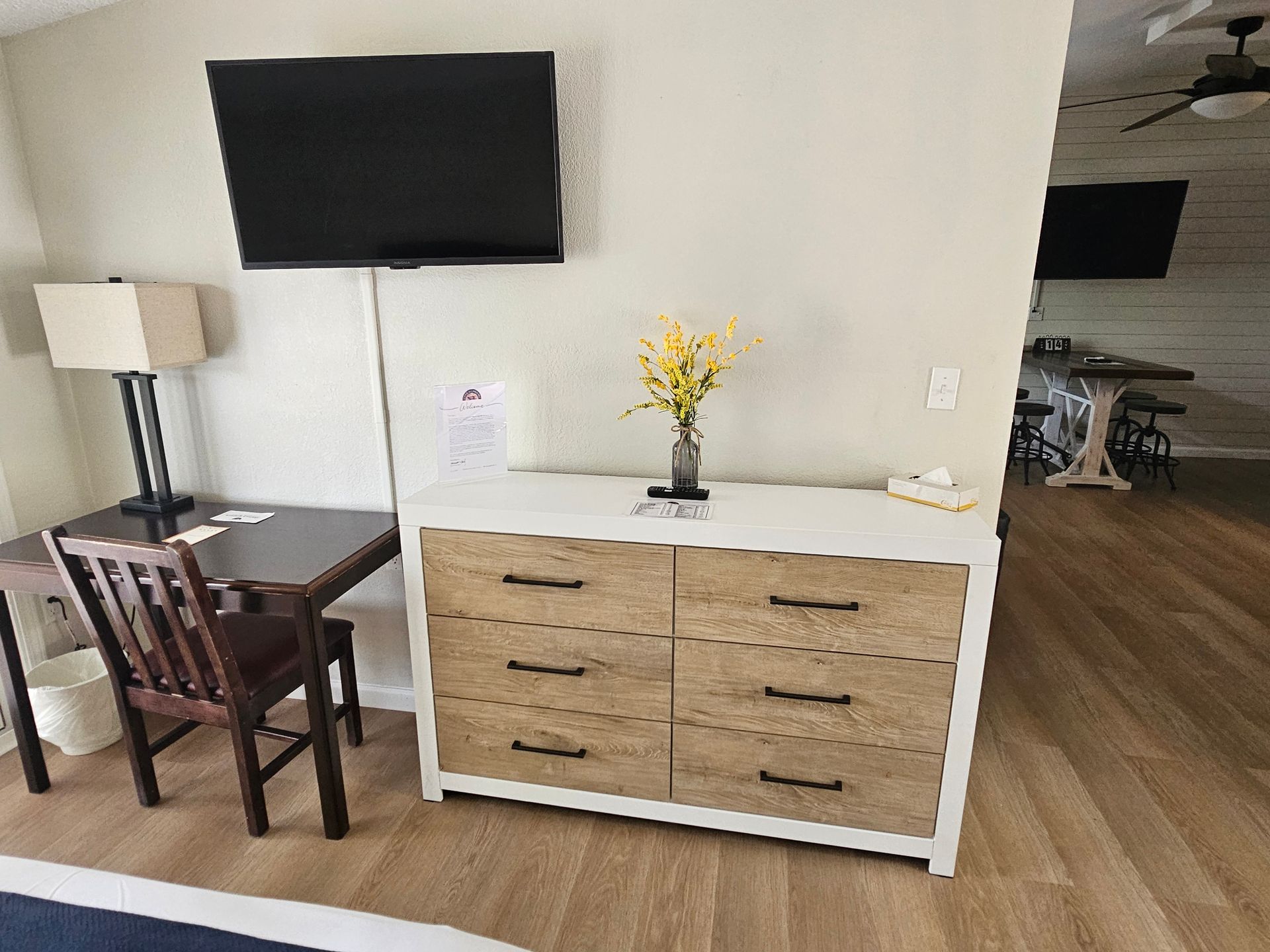 tv and dresser in seating area family suite lodge at chalk hill