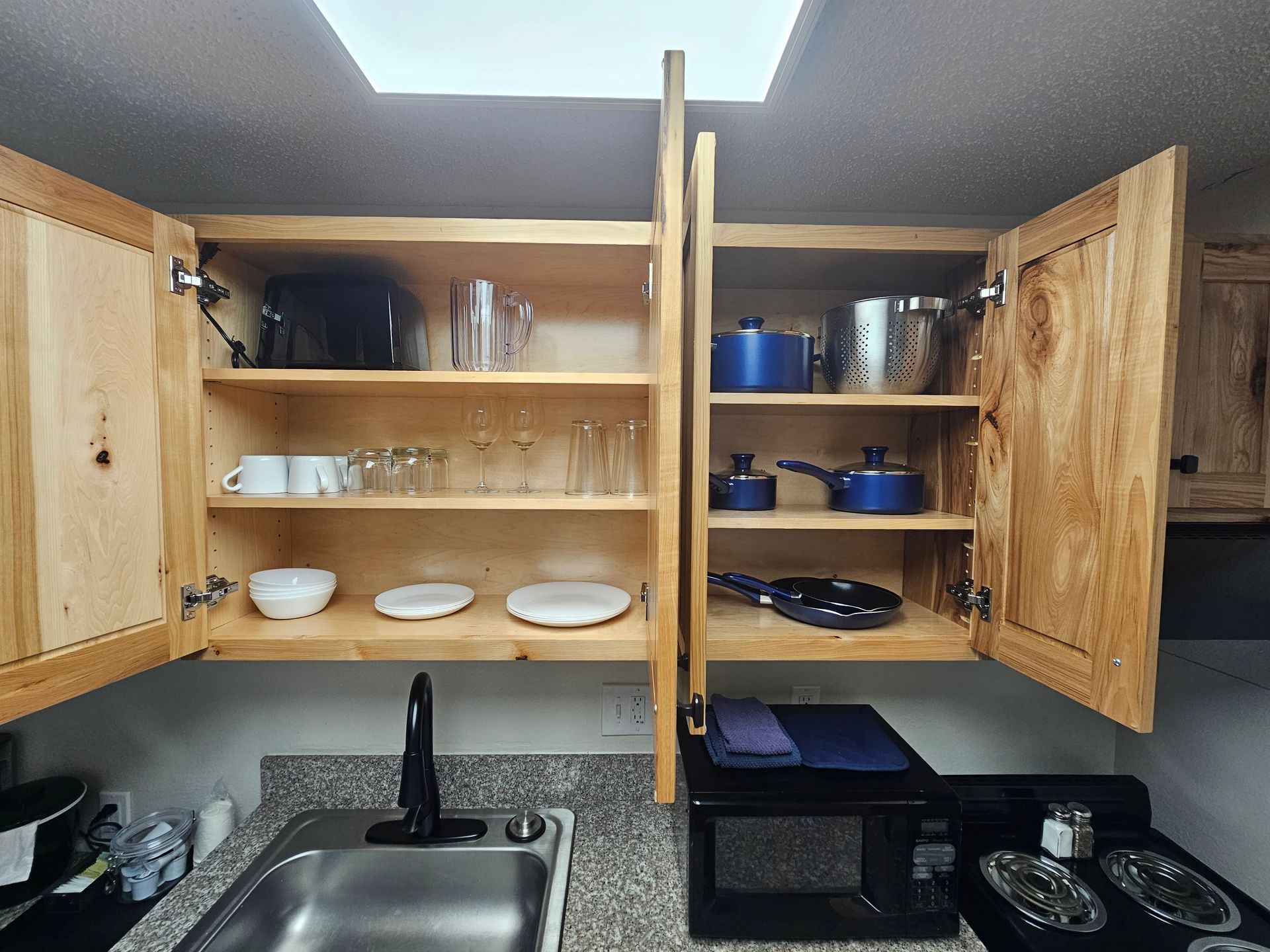 view of inside the cabinets of the kitchenette