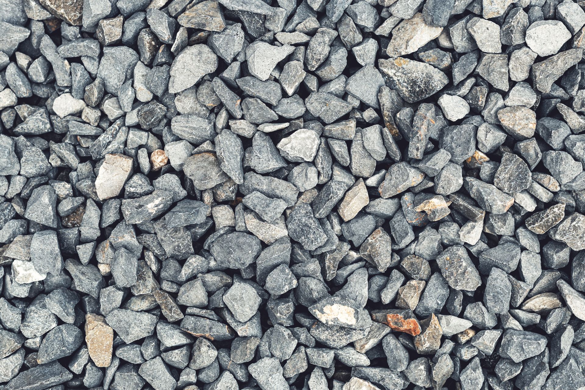 Gray gravel stones shown in close-up from landscaping stone supplier offering bulk decorative rock. Gray gravel stones shown in close-up from landscaping stone supplier offering bulk decorative rock.