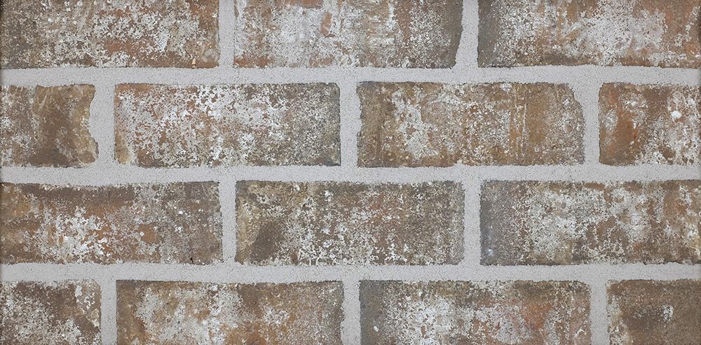 Brick wall with brown bricks and white mortar.