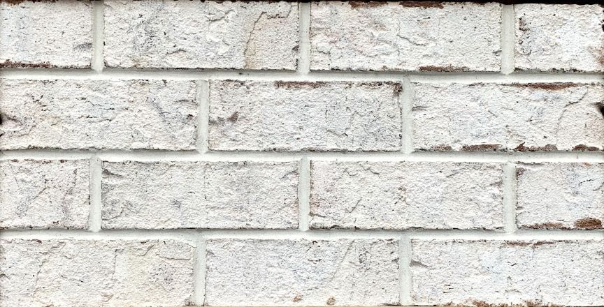 White brick wall with visible mortar lines.