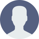 A silhouette of a man 's head in a blue circle.