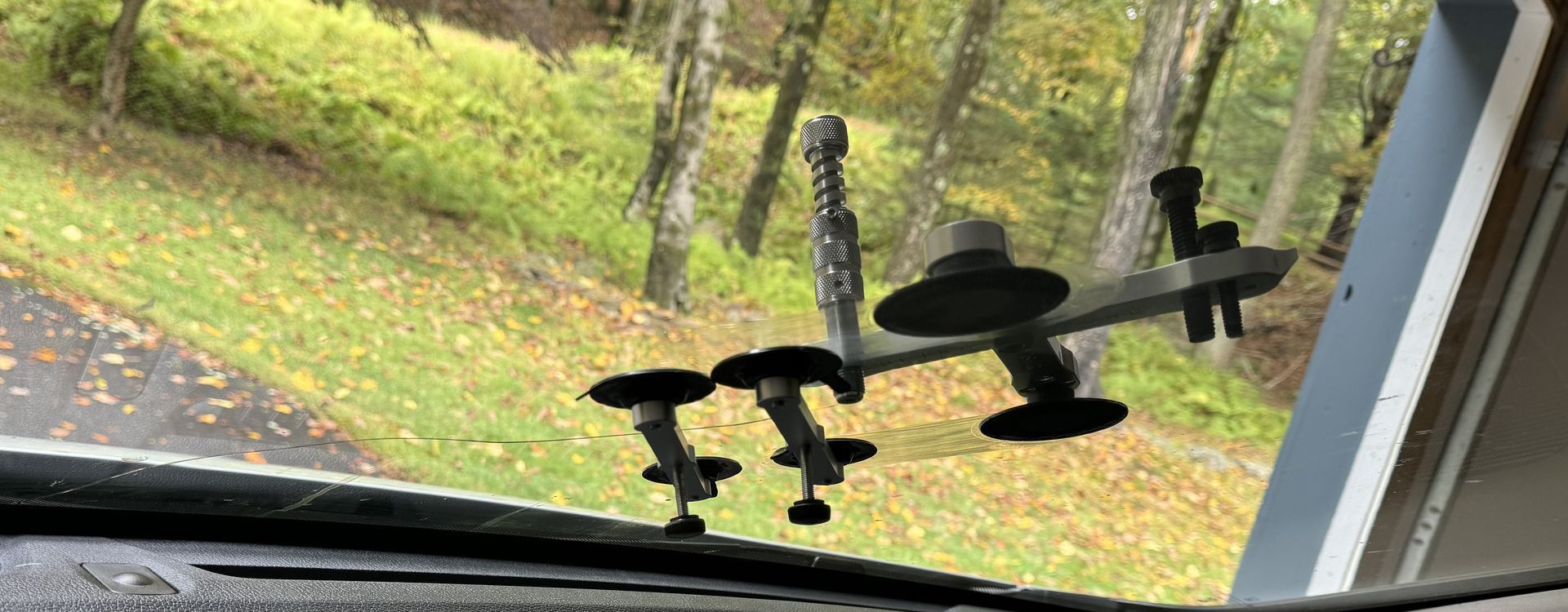 Ultra Bond long crack repair tools tools and resins in progess on a long windshield crack repair