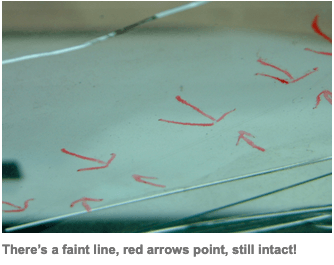 There is a faint line of red arrows pointing to the 12 inch crack repair that remained intact after a rollover crash