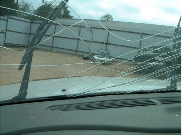 A car windshield with a lot of wires coming out of it
