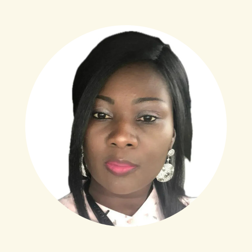 A woman wearing earrings and a pink shirt is in a circle