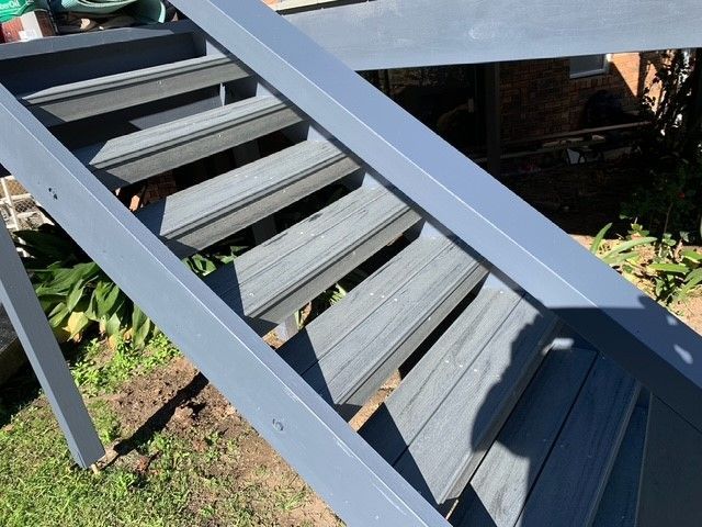 A set of stairs leading up to a house