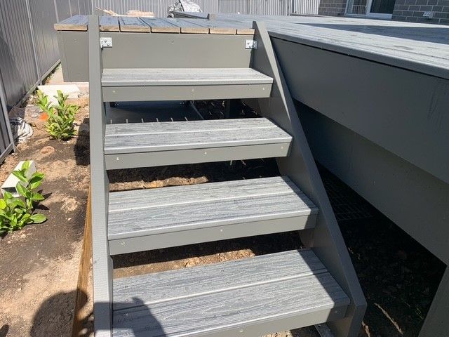 A set of stairs leading up to a deck.