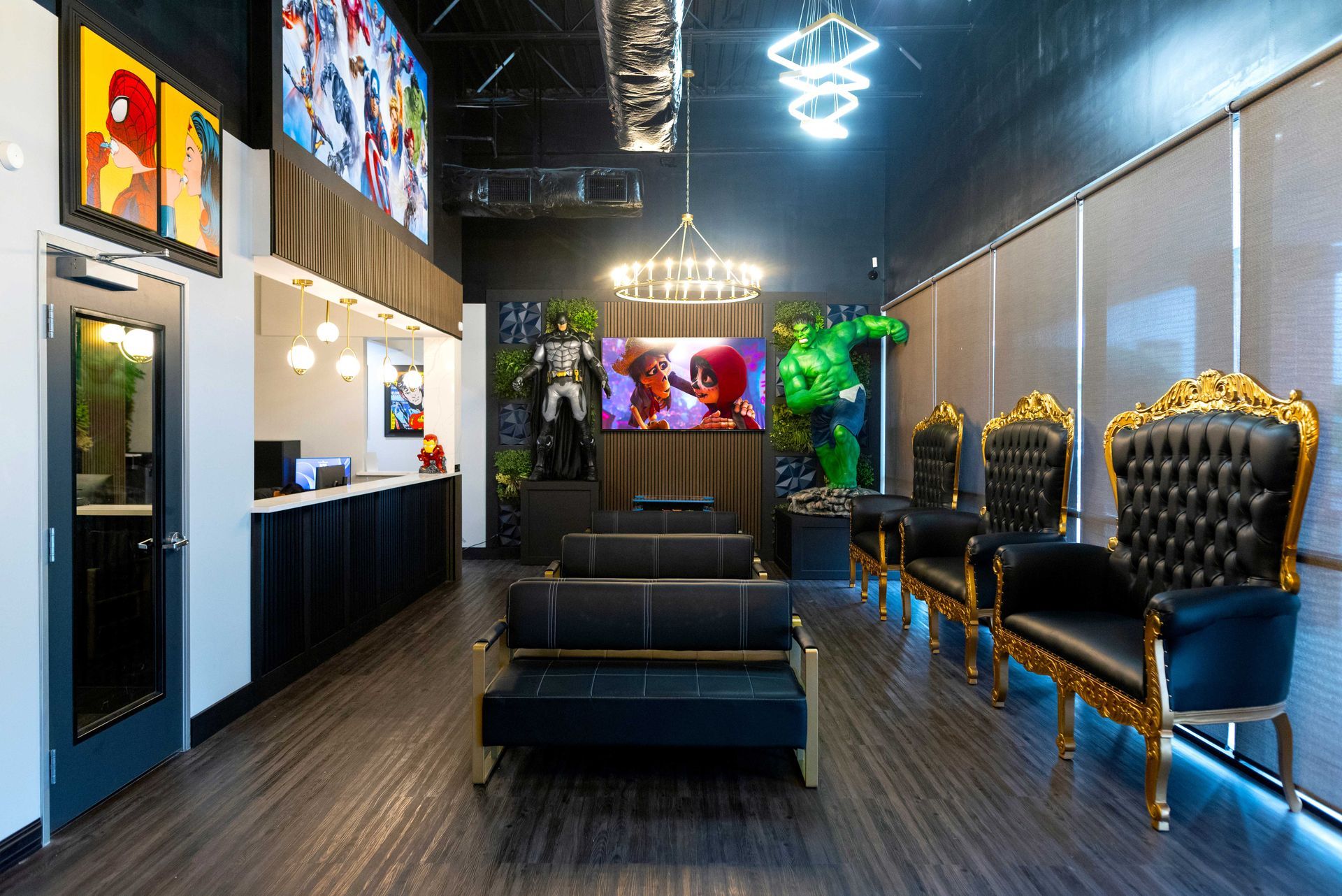 Modern lounge with black tufted chairs, mirrors, and neon lights, featuring colorful decor and dark flooring
